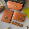Personalized leather gift set with wallet, passport cover, keychain, and sunglass case in tan color with engraved name tags