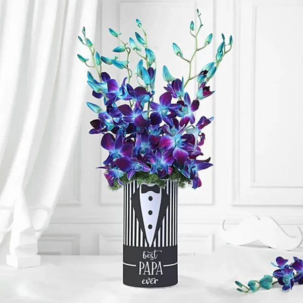 Blue orchid and asparagus flower arrangement in tuxedo-themed “Best Papa Ever” vase for Father’s Day gift