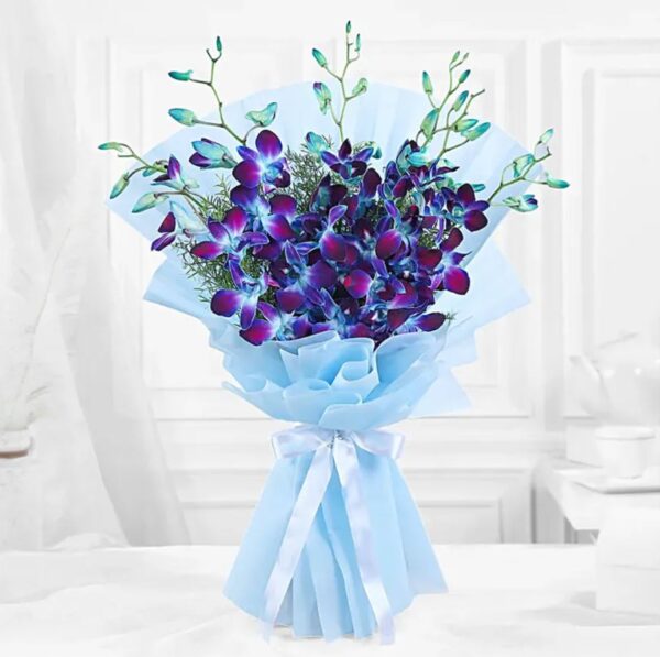 Blue orchid flower bouquet wrapped in sky-blue paper with ribbon